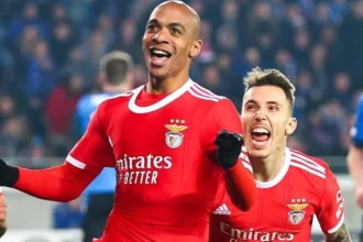 Joao Mario celebrates his goal for Benfica .