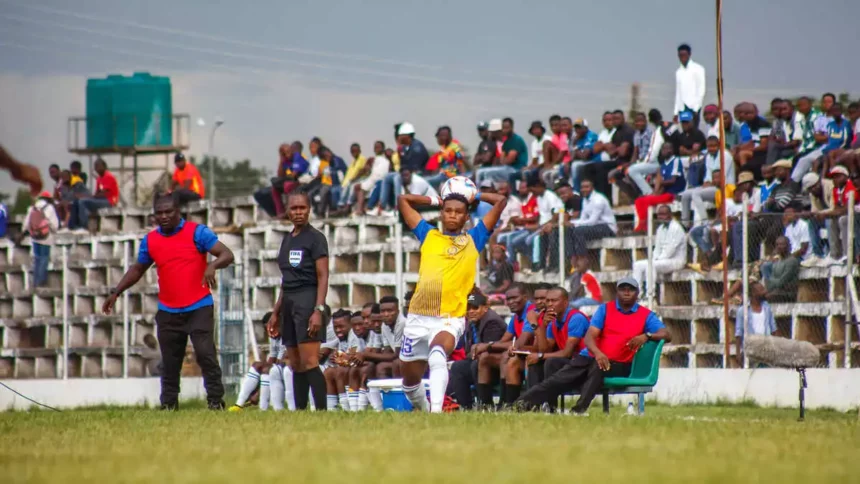 The technical bench of Nchanga Rangers FC watches as their player takes a throw in. - (Image courtesy of NR-Media via FB/Brave Nchanga Rangers)