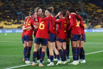 Spain players celebrate the team's first goal scored an own goal by Valeria Del Campo of Costa Rica (not pictured) (Photo by Catherine Ivill/Getty Images)