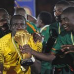 Kennedy Mweene celebrates with the AFCON trophy. (Picture via Getty Images)