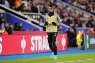 Patson Daka warms up from the bench during the UEFA Conference League Quarter Final Leg One match between Leicester City and PSV Eindhoven at Leicester City Stadium on April 7, 2022 in Leicester, United Kingdom. (Photo by Plumb Images/Leicester City FC via Getty Images)