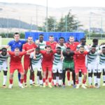 Kafue Celtic players with their opponents in Georgia after a match. (Picture via Kafue Celtic)