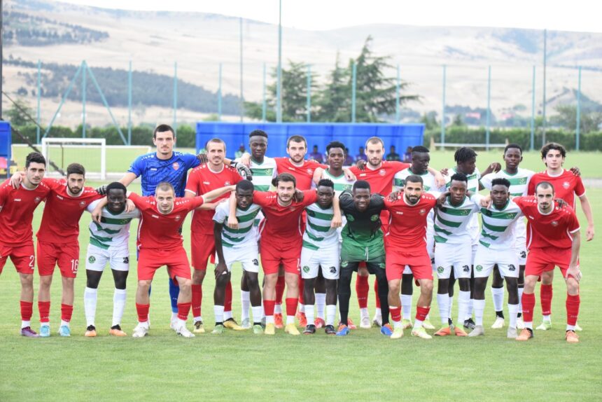 Kafue Celtic players with their opponents in Georgia after a match. (Picture via Kafue Celtic)