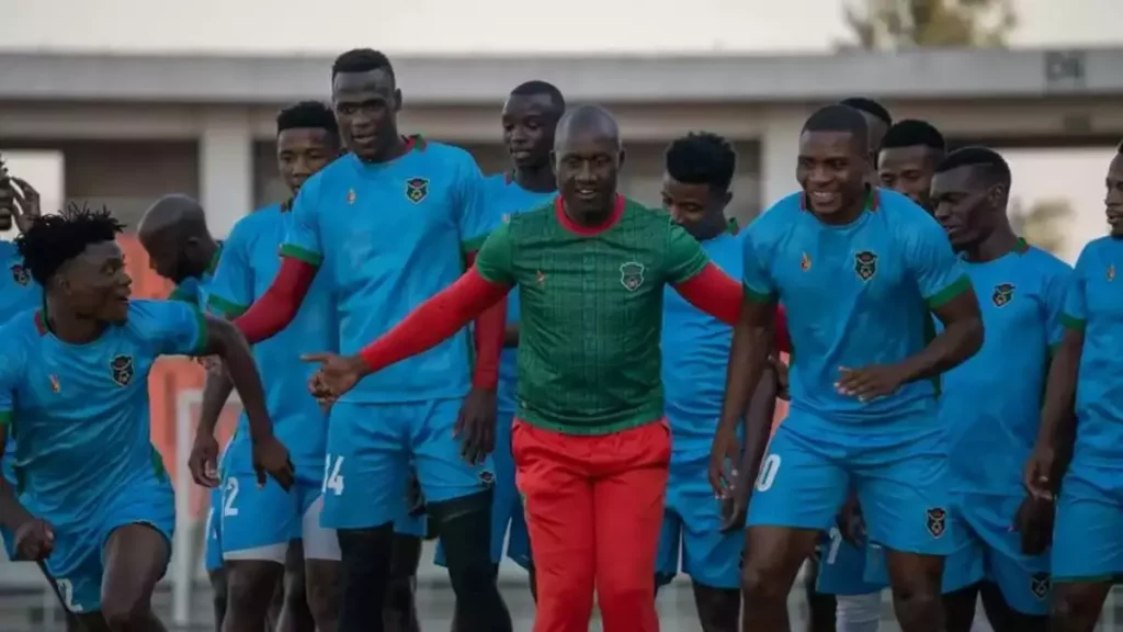 Malawi National Football team caretaker Coach Patrick Mabedi sharing a light momemt with his players. (Picture via FB/Football Association of Malawi)