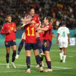 Jennifer Hermoso (top) celebrates with her Spainsh teammates after scoring her team's second goal. (Photo by Phil Walter/Getty Images)