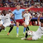 Erling Haaland competes for the ball with Tanguy-Austin Nianzou Kouassi and Thomas Delaney during the UEFA Champions League group G match between Sevilla FC and Manchester City at Estadio Ramon Sanchez Pizjuan. (Photo by Juanjo Ubeda/Quality Sport Images/Getty Images)