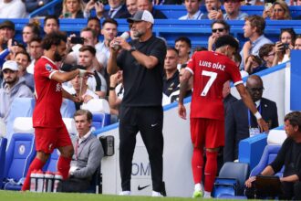 Mohamed Salah of Liverpool reacts as he is substituted as Jurgen Klopp looks on during the Premier League match between Chelsea FC and Liverpool FC at Stamford Bridge. (Photo by Marc Atkins/Getty Images)
