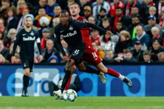 Enock Mwepu and Jordan Henderson battle for the ball during the UEFA Champions League group E match between Liverpool FC and RB Salzburg at Anfield on October 2, 2019 in Liverpool, United Kingdom. (Photo by TF-Images/Getty Images)