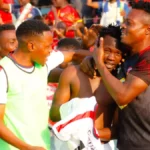 Rickson Ng'ambi celebrates his goal shirtless with his teammates during an MTN Super League. (Photo via FC MUZA media)