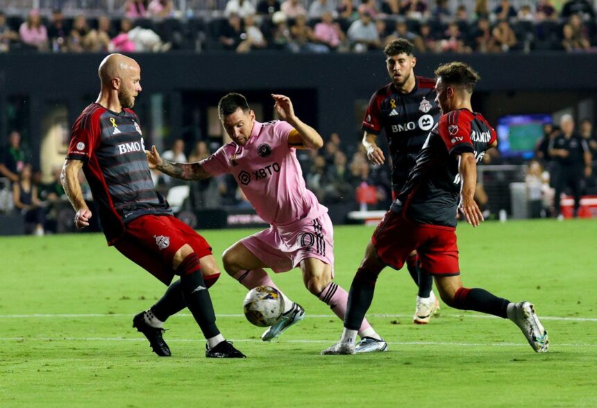 Lionel Messi (C) vies for the ball during the Major League Soccer (MLS) football match between Inter Miami CF and Toronto FC at DRV PNK Stadium in Fort Lauderdale, Florida, on September 20, 2023. (Photo by Chris Arjoon / AFP) (Photo by CHRIS ARJOON/AFP via Getty Images)