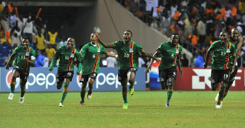 Chipolopolo Boys celebrate victory against Ivory Coast at the stade de l'amitie in Libreville on February 12, 2012, during their Africa Cup of Nations. (Photo by ISSOUF SANOGO/AFP via Getty Images)