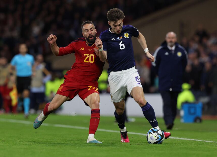 Dani Carvajal of Spain vies with Kieran Tierney of Scotland during the UEFA EURO 2024 qualifying round group A match between Scotland and Spain at Hampden Park on March 28, 2023 in Glasgow, Scotland. (Photo by Ian MacNicol/Getty Images)