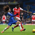 Bukayo Saka of Arsenal holds off Marc Cucurella of Chelsea during the Premier League match between Chelsea FC and Arsenal FC at Stamford Bridge on November 06, 2022 in London, England. (Photo by Justin Setterfield/Getty Images)