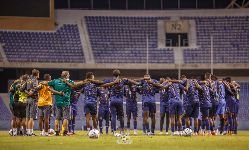 The Chipolopolo Boys praying after a training session at the Levy Mwanawansa stadium in Ndola. (Photo via FAZ Media)