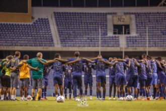 The Chipolopolo Boys praying after a training session at the Levy Mwanawansa stadium in Ndola. (Photo via FAZ Media)