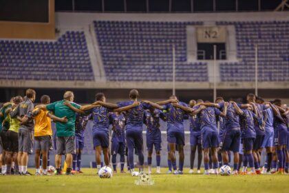 The Chipolopolo Boys praying after a training session at the Levy Mwanawansa stadium in Ndola. (Photo via FAZ Media)