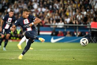 Kylian Mbappe kicks to miss to score on a penalty kick during the French L1 football match between Paris-Saint Germain (PSG) and Montpellier Herault SC at The Parc des Princes Stadium in Paris on August 13, 2022. (Photo by STEPHANE DE SAKUTIN / AFP) (Photo by STEPHANE DE SAKUTIN/AFP via Getty Images)