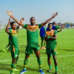 Freddy Michael Kouablan (in the middle) celebrates his goal during a Zambian Super League match with teammates. (Photo via Green Eagles FC)