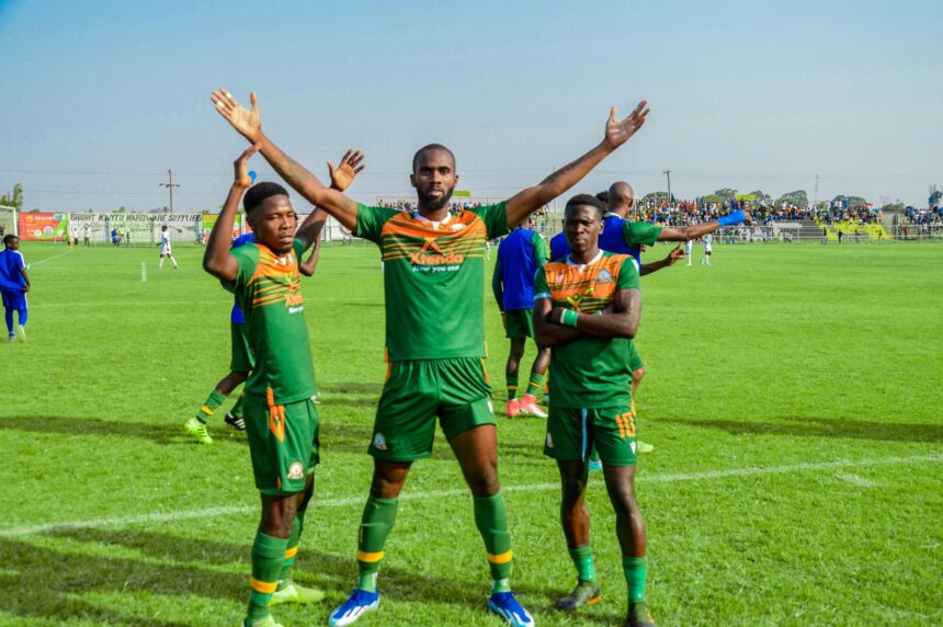 Freddy Michael Kouablan (in the middle) celebrates his goal during a Zambian Super League match with teammates. (Photo via Green Eagles FC)