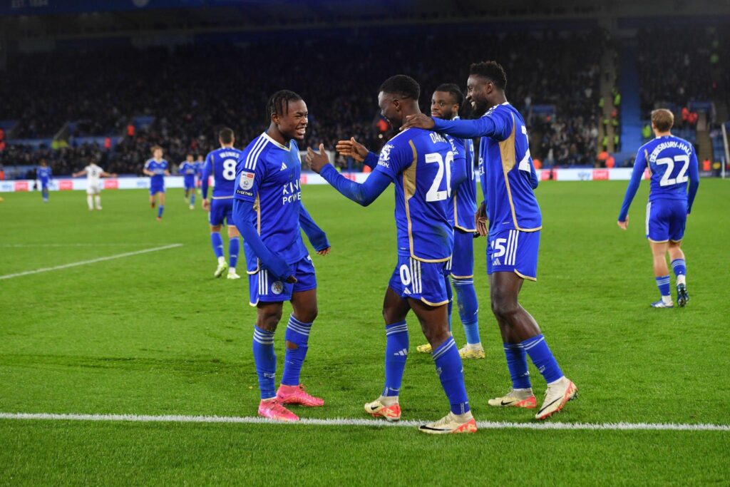 Patson Daka celebrates with Abdul Fatawu of Leicester City and Wilfred Ndidi (Photo by Plumb Images/Leicester City FC via Getty Images)