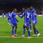 Patson Daka celebrates with Abdul Fatawu of Leicester City and Wilfred Ndidi (Photo by Plumb Images/Leicester City FC via Getty Images)