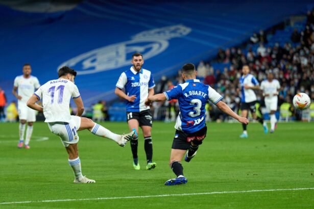 Marco Asensio of Real Madrid scores their team's first goal during the LaLiga Santander match between Real Madrid CF and Deportivo Alaves at Estadio Santiago Bernabeu on February 19, 2022 in Madrid, Spain. (Photo by Angel Martinez/Getty Images)