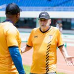 Chipolopolo head coach Avram Grant talking to his assistant Moses Sichone during a training session at the Heroes National Stadium in Lusaka. (Photo via FAZ media)