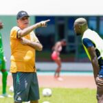 Avram Grant giving instructions to Chipolopolo defender Tandi Mwape during a training session at the Heroes National Stadium in Lusaka in Janaury 2024 ahead of the AFCON. (Photo via FAZ media)