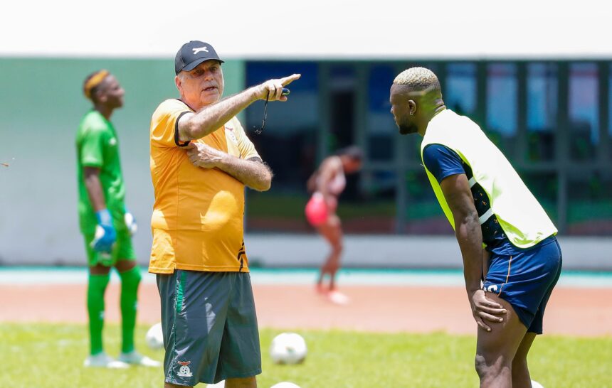 Avram Grant giving instructions to Chipolopolo defender Tandi Mwape during a training session at the Heroes National Stadium in Lusaka in Janaury 2024 ahead of the AFCON. (Photo via FAZ media)
