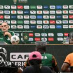 Avram Grant (L) and Chipolopolo Lubambo Musonda (R) during a press conference at the Laurent Pokou stadium in San-Pedro on January 16, 2024 on the eve of the Africa Cup of Nations (CAN) 2024 football match between Democratic Republic of Congo and Zambia. (Photo by SIA KAMBOU/AFP via Getty Images)