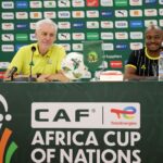 Hugo Broos and Percy Tau during a press conference at Korhogo's Stade, Amadou Gon Coulibaly. (Photo via X/@BafanaBafana)