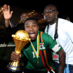 Christopher Katongo celebrates with the trophy after winning the 2012 African Cup of Nations Final between Zambia and Ivory Coast at the Stade de l'Amitie in Libreville, Gabon. Photo: Ben Radford/Visionhaus (Photo by Ben Radford/Corbis via Getty Images)