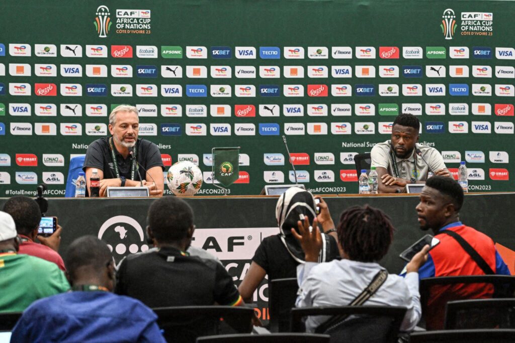 Democratic Republic of Congo's coach Sebastien Desabre (L) and captain Chancel Mbemba speak during a press conference at the Laurent Pokou stadium in San-Pedro on January 16, 2024 on January 16, 2024 on the eve of the Africa Cup of Nations (CAN) 2024 football match between Demorcratic Republic of Congo and Zambia. (Photo by SIA KAMBOU/AFP via Getty Images)