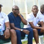 Alex Namazamba (second from left) on the Green Eagles bench during a Zambian Super League match. (Photo via Green Eagles FC Media)
