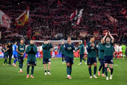 MUNICH, GERMANY - APRIL 17: Players of Arsenal applaud the fans after the team's defeat and elimination from the UEFA Champions League after the UEFA Champions League quarter-final second leg match between FC Bayern München and Arsenal FC at Allianz Arena on April 17, 2024 in Munich, Germany. (Photo by David Price/Arsenal FC via Getty Images)