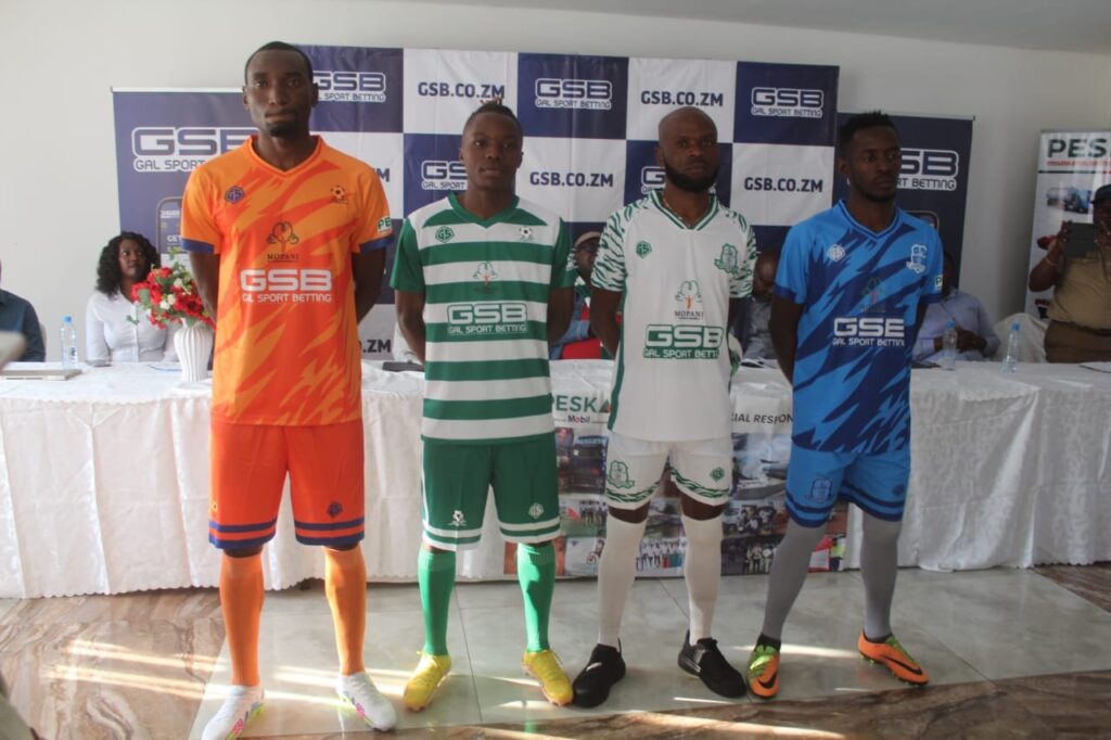 Mufulira Wanderers players posing in their 2023–24 GBS-sponsored jerseys. (Photo via Mufulira Wanderers FC)
