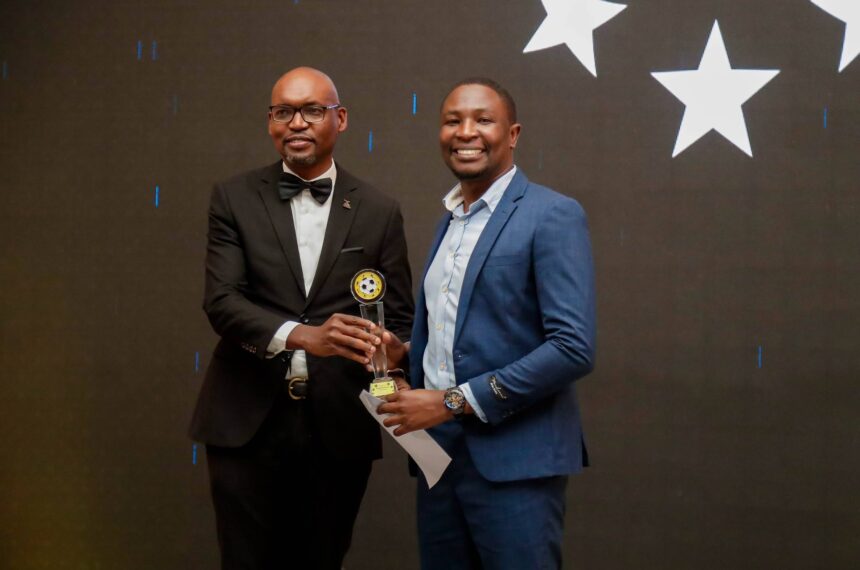 Calvin Kaumba Chikenge(R) receiving his award for the best Journalist of the year during the 2023/24 MTN/FAZ Super League awards at the Mulungushi conference center in Lusaka. (Photo via FAZ media)