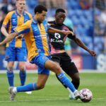 Patson Daka of Leicester City in action with Luca Hoole of Shrewsbury Town during the Pre-Season friendly match between Shrewsbury Town and Leicester City at Croud Meadow on July 23, 2024 in Shrewsbury, England. (Photo by Plumb Images/Leicester City FC via Getty Images)