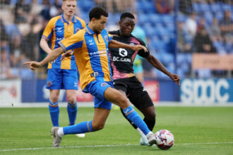 Patson Daka of Leicester City in action with Luca Hoole of Shrewsbury Town during the Pre-Season friendly match between Shrewsbury Town and Leicester City at Croud Meadow on July 23, 2024 in Shrewsbury, England. (Photo by Plumb Images/Leicester City FC via Getty Images)