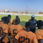 Wedson Nyirenda having a talk with some of the national team players at the Woodlands stadium in Lusaka. (Photo via FAZ media)