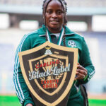 Carol Kayemba poses with the 2024 Charity shield at the Levy Mwanawansa stadium in Ndola where they beat Choma Warriors FC 10-0. (Photo via GBWFC media)