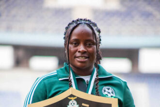 Carol Kayemba poses with the 2024 Charity shield at the Levy Mwanawansa stadium in Ndola where they beat Choma Warriors FC 10-0. (Photo via GBWFC media)