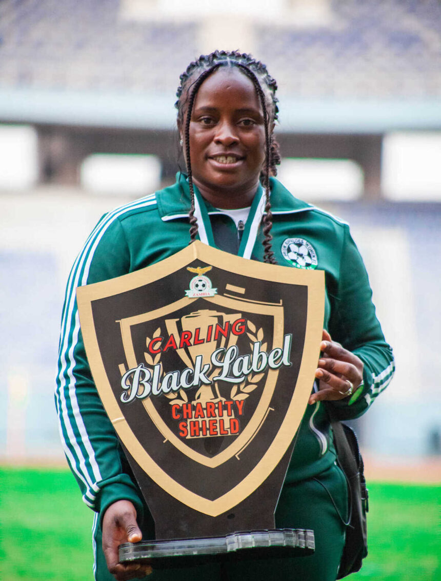 Carol Kayemba poses with the 2024 Charity shield at the Levy Mwanawansa stadium in Ndola where they beat Choma Warriors FC 10-0. (Photo via GBWFC media)