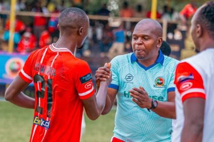 Godfrey Ngwenya and Chisi Mbewe shaking hands. (Photo via Red Arrows FC media)