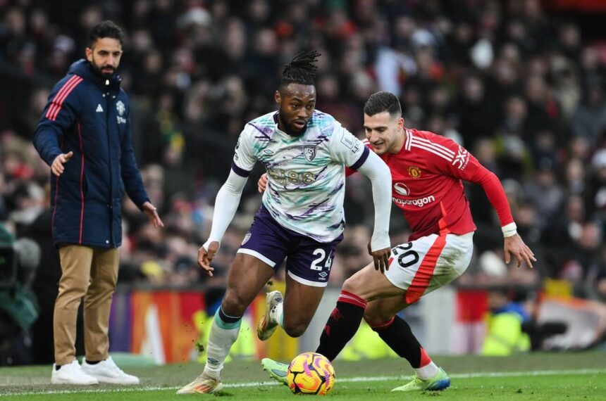 Manchester, UK. 22nd Dec, 2024. Antoine Semenyo of Bournemouth gets the better of Diogo Dalot of Manchester United during the Premier League match Manchester United vs Bournemouth at Old Trafford, Manchester, United Kingdom, 22nd December 2024 (Photo by Craig Thomas/News Images) in Manchester, United Kingdom on 12/22/2024. (Photo by Craig Thomas/News Images/Sipa USA via Alamy Live News)