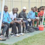 Kebby Hachipuka with members of his technical bench during a super league game. (Photo via Green Eagles FC media)