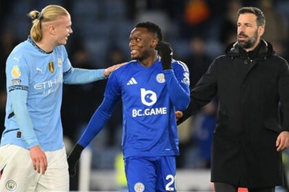 Erling Haaland of Manchester City laughs with Patson Daka of Leicester as Ruud van Nistelrooy, Manager of Leicester City, looks on at the end of the Premier League match between Leicester City FC and Manchester City FC at The King Power Stadium on December 29, 2024 in Leicester, England. (Photo by Michael Regan/Getty Images)