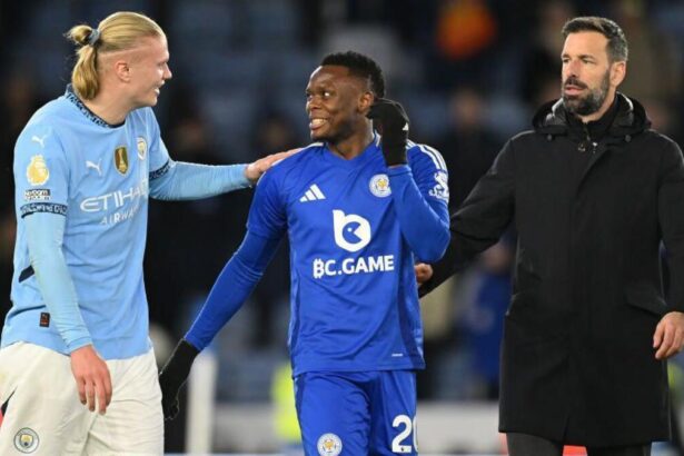 Erling Haaland of Manchester City laughs with Patson Daka of Leicester as Ruud van Nistelrooy, Manager of Leicester City, looks on at the end of the Premier League match between Leicester City FC and Manchester City FC at The King Power Stadium on December 29, 2024 in Leicester, England. (Photo by Michael Regan/Getty Images)