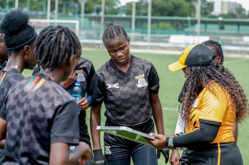 Natasha Nkaka and her teammates receiving instructions from head coach Carol Kanyemba during training in Lusaka. (Photo via FAZ media)