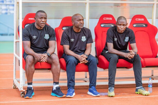 Zesco interim coach Emmanuel Siwale [in the middle] with his assistants. (Photo via Zesco United FC media)